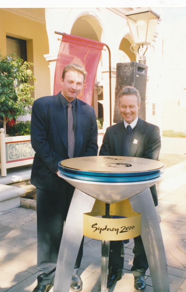 PRS118_105_001: Lord Mayor David Borger (left) with Sydney Olympics Cauldron in Parramatta, 2000 (City of Parramatta Council Archives)