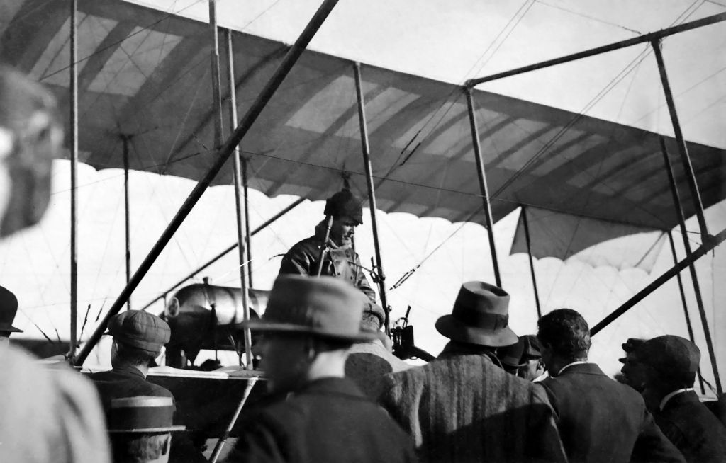 Billy Hart sitting on his Bristol Boxkite with a crowd of onlookers at Penrith ca.1911. Image source: State Library of New South Wales
