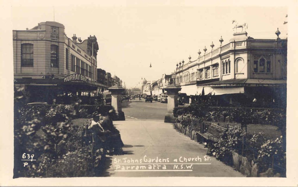 Church Street, Parramatta, looking north through St. John's Park towards the intersection with Macquarie Street, ca. 1930s