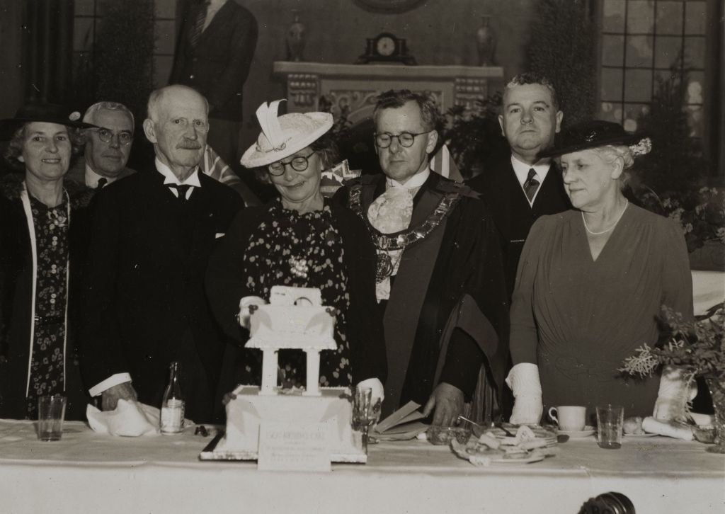 Parramatta's sesqui-centennial celebrations, view of Parramatta Mayor and unknown persons cutting of 150th birthday cake, 1938. City of Parramatta Local Studies Library: LSP00485