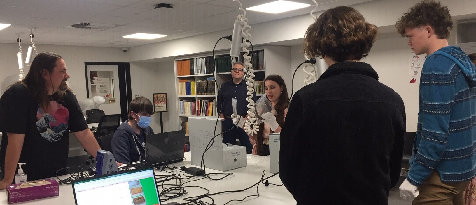 Council's Cultural Collections Officer with Macquarie University students