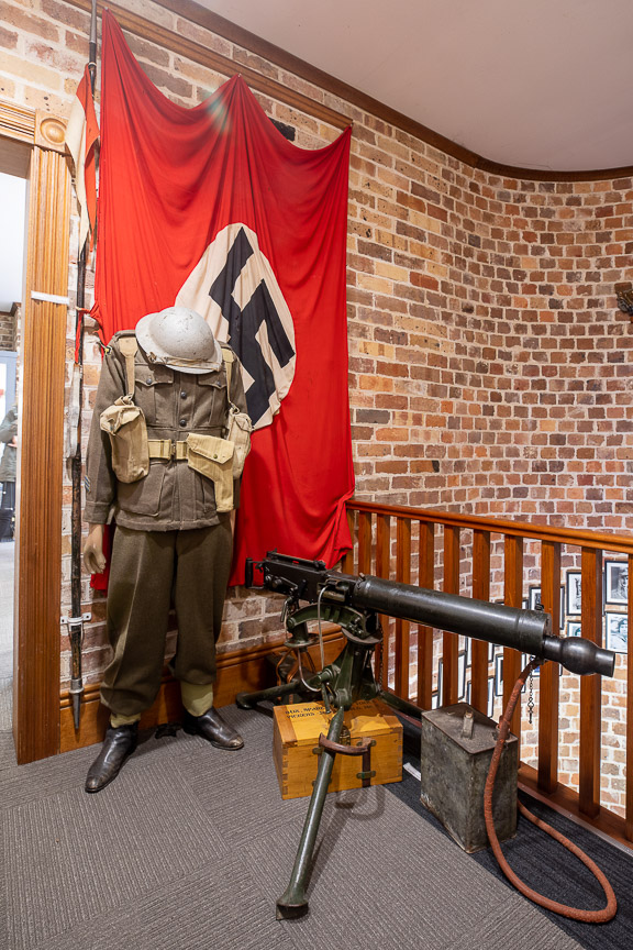 Australian Vickers .303 medium machine gun, service dress jacket or pattern and Swastika drape  