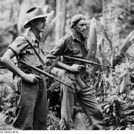 From left: Private Leon Ravet of Parramatta, and Private Bernard Kentwell of Cronulla, on the alert while on patrol duty with their Owen sub machine guns. Source: Australian War Memorial 018320